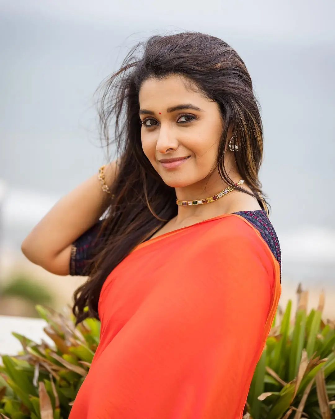 priya bhavani shankar wearing beautiful orange saree blue blouse